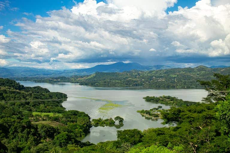 Breathtaking aerial view of Suchitoto Lake with lush greenery in El Salvador.