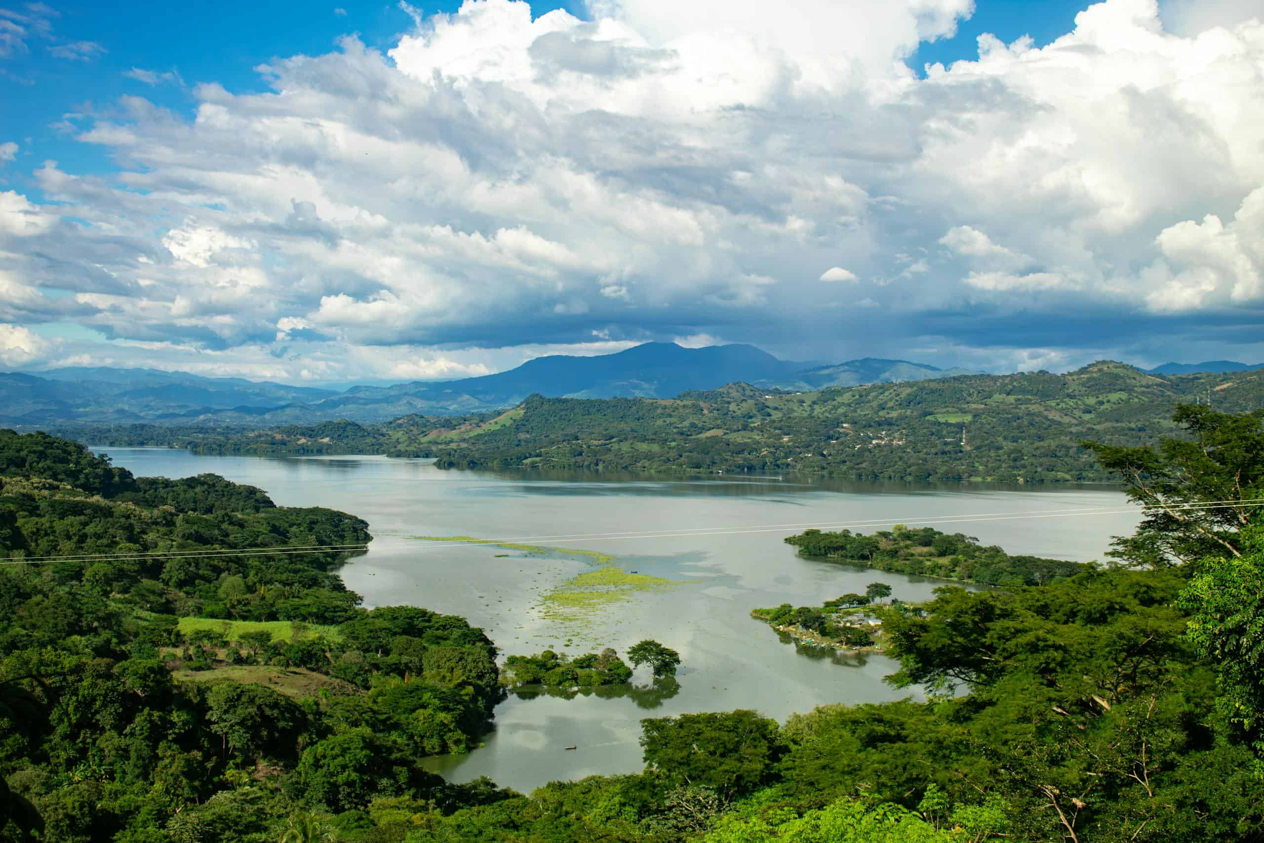 Breathtaking aerial view of Suchitoto Lake with lush greenery in El Salvador.