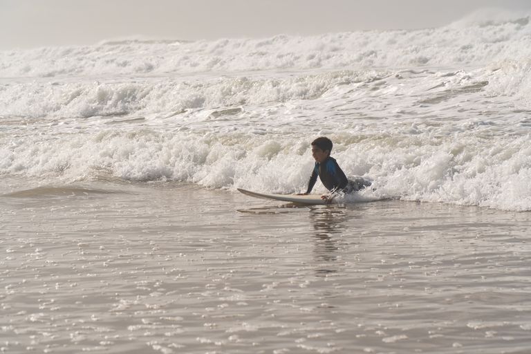 A child learning to surf at El Tunco El Salvador
