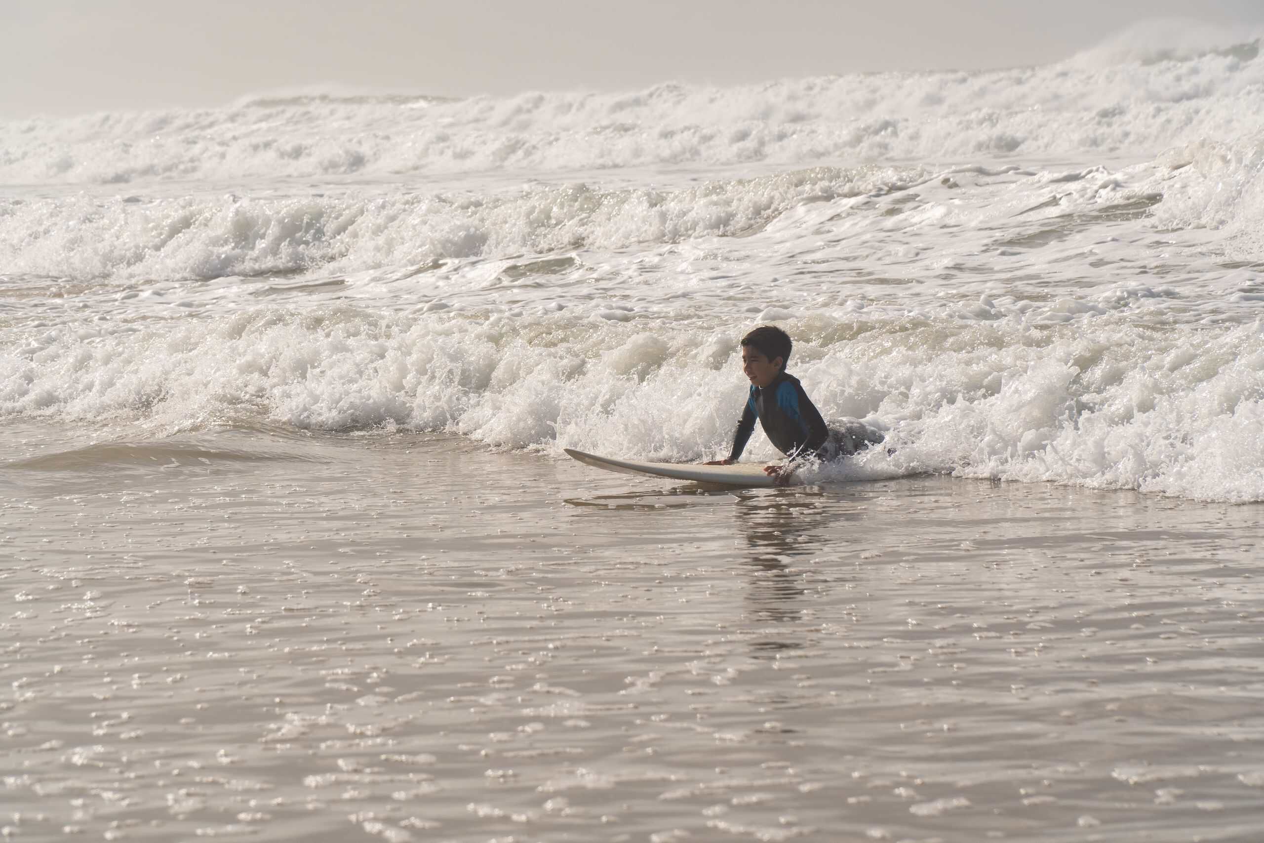 A child learning to surf at El Tunco El Salvador